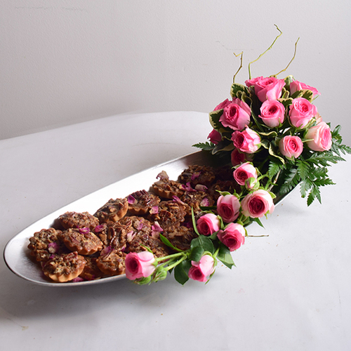 You & Me 20 - silver
  acrylic tray  decorated with fresh
  roses flowers and mini pecan pies.