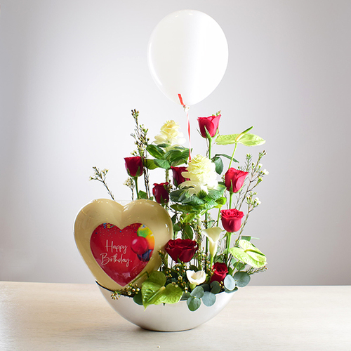 al khayal 9 - acrylic
  tray with a decoration of fresh , roses and brasica flowers with Happy
  Birthday Big heart chocolate and ballons.