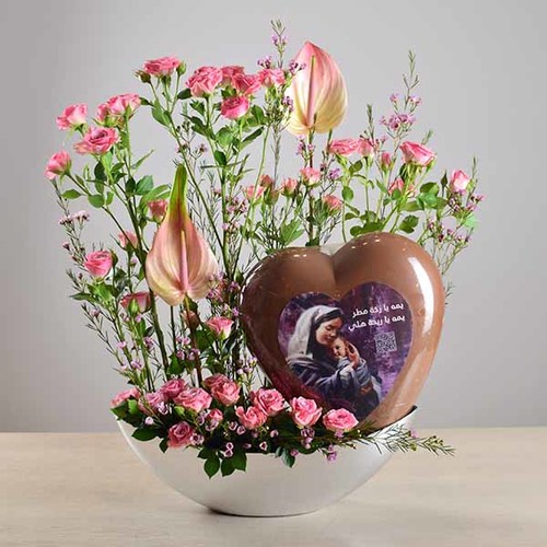 janati 11 - acrylic
  tray decorated with big heart chocolate printed with barcode of a song,  and fresh anthiorium and roses
  flowers.