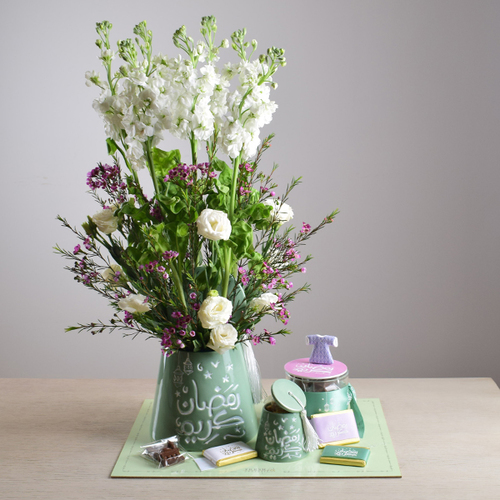 Ramadan Yijmana 51 - 2
  ceramic tarbush with 1 acrylic chocolates and fresh matola, wax flower and
  roses flowers on a tray.