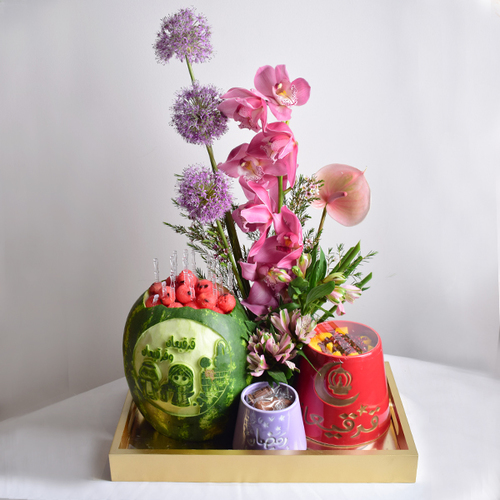 Helal Gergean 11 - watermelon carving with 2 ceramic tarbush of mixed fresh fruits and a decoaration of fresh cymbidium and allum flowers