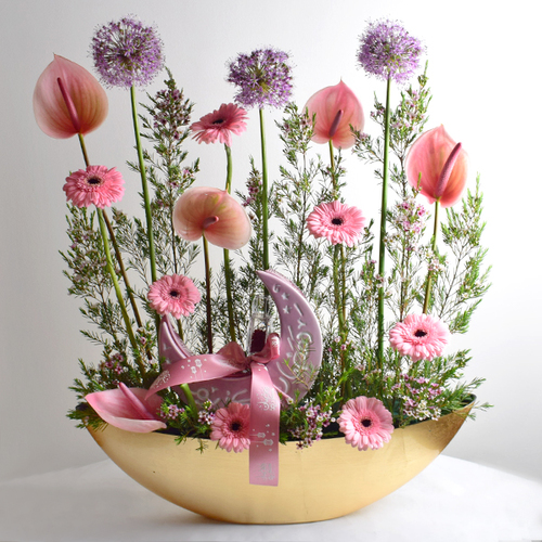 Helal Gergean 15 - arylic
  gold tray with ceramic cresent moon box with chocolates and ramadan sweets,
  saffron and a decoration of fresh anthorium, gerbera, allum and wax flowers.