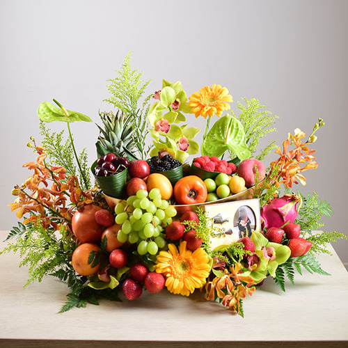 congrats 1 - tray
  with fresh mixed fruitts, graduation frame, and a decoration of fresh
  anthorium, gerbera, baby orchid flowers.