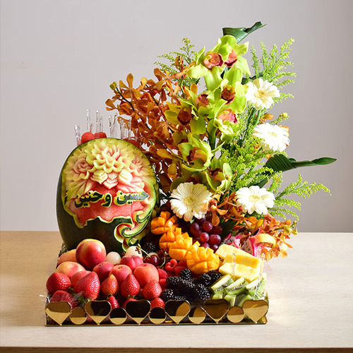 congrats 2 - congrats
  watermelon carving tray with fressh fruits and a decoration of fresh gerbera,
  cymbidium and baby orchid flowers.