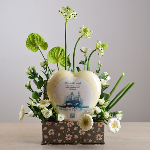 eid adhha & haj mabror 10 - big
  heart chocolate  on a box decorated
  with fresh gerbera, anthorium, lisianthus flowers.