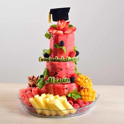 congrats 4 - congrats
  watermelon fruit cake design with fresh fruit cut and graduation cap box with
  chocolate.