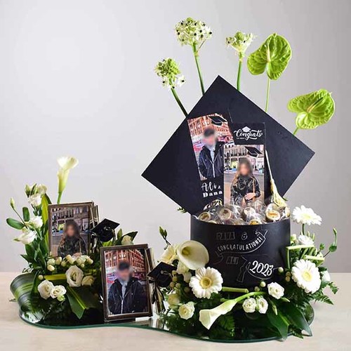 Fresh Couture - congrats 5 - Costumized
  graduation cap box with 2 graduation frame, chocolates fresh anthorium,
  gerbera, calla and lisianthus flowers.