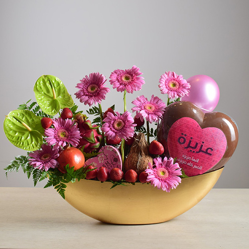 Birthday 5 - Happy
  Birthday Writing on a Big Heart Chocolate with fresh gerbera, and anthorium
  flowers on a box with Ballons, fresh fruits and chocolates on a heart box.