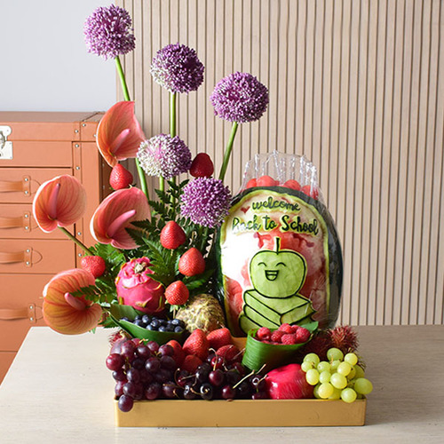 someone special 7 - A square tray
  with watermelon carved and composed of fresh fruit, arranged with natural
  flowers, Anthurium and allum flower.