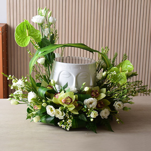 someone special 8 - Berries
  Salad on a ceramic face vase decorated with fresh anthorium, cymbidium,
  lisianthus and wax flowers.