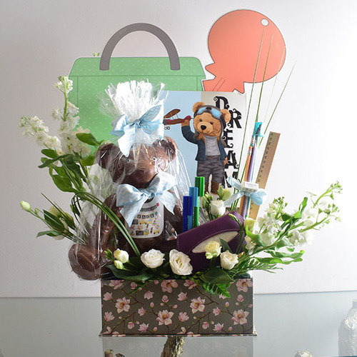 Back to school 2 - Back
  to school teddy bear chocolate with school supplies and fresh lisianthus and
  matola flowers.