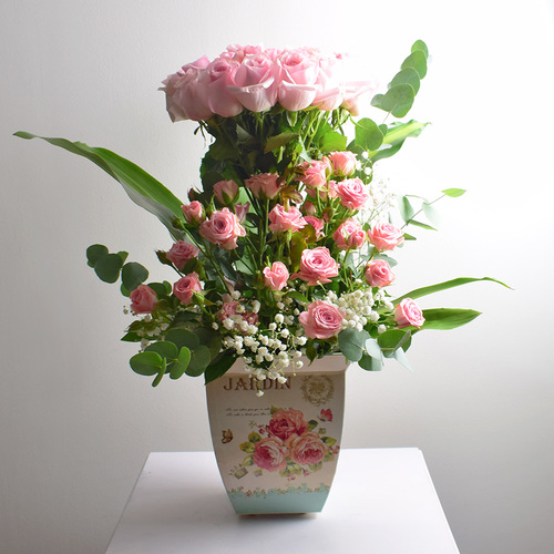 my flower 2 - tin
  can vase with fresh roses and gypsophilia flowers with eucalyptus leaves.