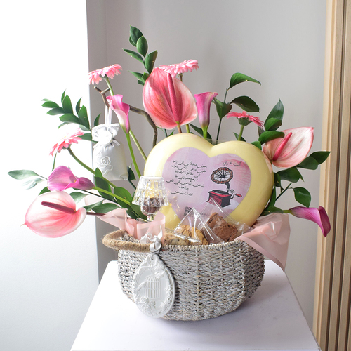 Anta Auomri 17 - basket
  with bif heart chocolates with electric lamp, cookies, brownies and
  acssesories with a decoration of fresh gerbera, calla, anthorium and greens.