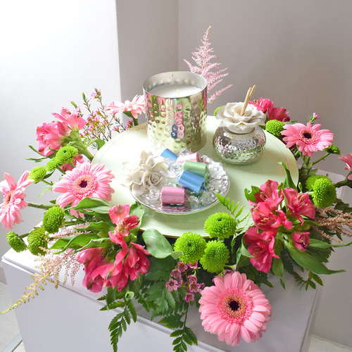 Me & You 28 - silver
  color candle with ceramic perfume and tray with chocolates and a decoration
  of fresh gerbera, chrysanth, astromeria, astilbe and wax flowers.