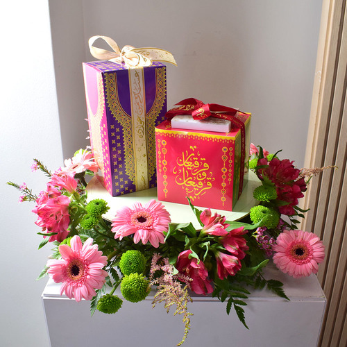 Me & You 30 - round
  tray with 2 box of chocolates and kuwaiti sweets with a decoration of fresh
  gerbera, astromeria, chrysanth, astilbe and wax flowers.