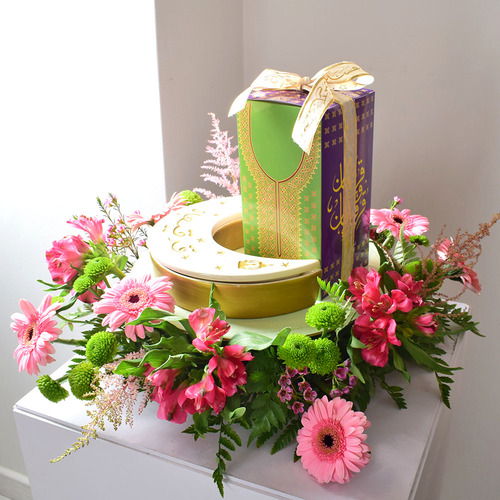 Me & You 34 - round
  tray with ceramic moon box with 1 box of 
  kuwaiti sweets with a decoration of fresh gerbera, astromeria,
  chrysanth, astilbe and wax flowers.