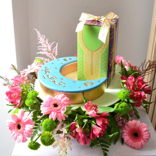 Me & You 35 - round
  tray with ceramic moon box with 1 box of 
  kuwaiti sweets with a decoration of fresh gerbera, astromeria,
  chrysanth, astilbe and wax flowers.