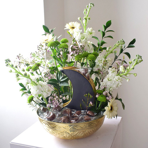 Al Eid 2 - gold
  tray with ceramic moon vase with a decoration of fresh gerbera, matola,
  chrysanth and wax flowers with chocolates.