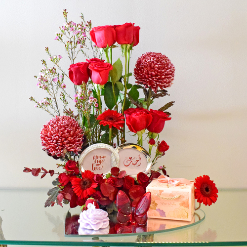 you + me 4 - mirror
  tray with chocolates, Picture Frame, scented Candle, crystal butterfly and
  fresh roses, gerbera deco peonia, baby roses and wax flowers.