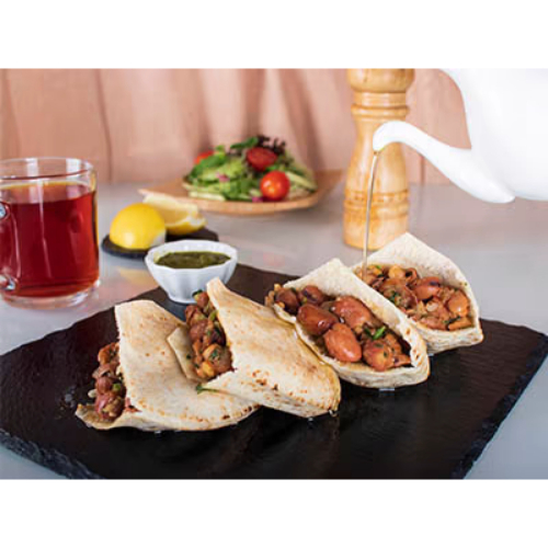 Foul Sandwich (Meal) - Foul with seasonings, salad and mild spicy green chutney. Served in arabic bread