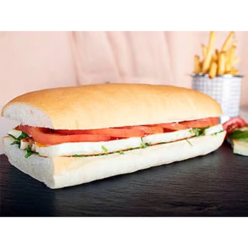 Grilled Hallumi Sandwich - Grilled halloumi, pesto sauce, tomato, rocca leaves & cucumber. Served with chips and salad.