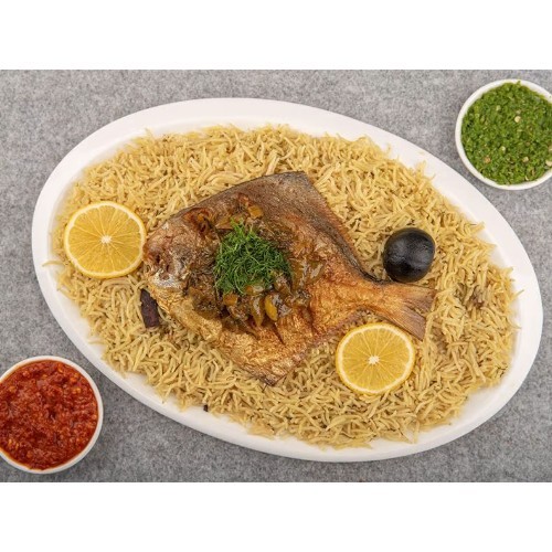 Zubaidi Fish Mutabbaq Platter - Served with daqoos, maabouj and yellow bread.