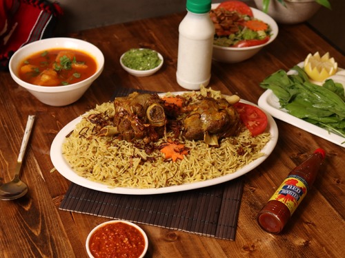 Majboos Platter - Piece, served with rice, stuffing, maabouj and broth.