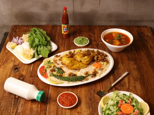 Chicken Majboos Platter - Half chicken, served with rice, stuffing, maabouj and broth.