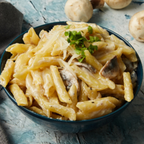 Biryani Gate - Creamy Mushroom Pasta - Penne pasta mixed with sauteed mushroom herbs and cheese sauce topped with parmesan cheese.