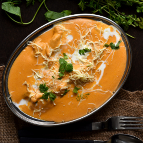 Mughlai Chicken - Boneless chicken pieces cooked with Indian spices egg white & garnished with coriander leaves and cream