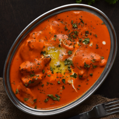 Butter Chicken - Chicken marinated in yogurt and spices, cooked in fresh tomato and cream