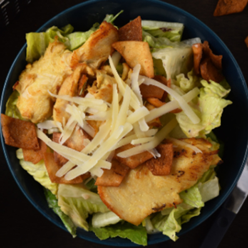 Biryani Gate - Caesar Salad - Romain lettuce caesar dressing ,croutons, topped with parmesan cheese.