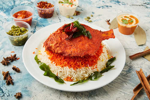 Fried Zubaidi Fish Biryani - Zubaidi cooked meticulously with Indian herbs, yogurt and long grain saffron flavored basmati rice