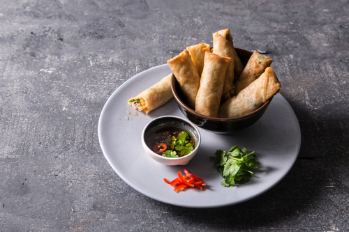 Chicken Spring Rolls - A small rolls of thin pastry filled with chicken, and then fried.