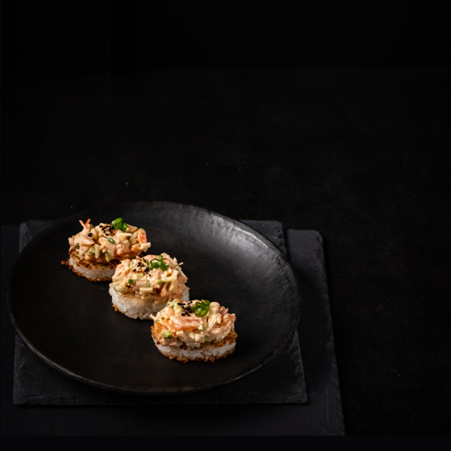 Salmon Crispy Rice - Salmon Crispy Rice - crispy sushi rice topped with mixed salmon with special sauce .