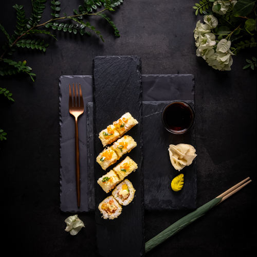 Tornado Roll - Fresh salmon, crab, mango, avocado, cucumber, crispy, and tobiko, served with honey mustard sauce.