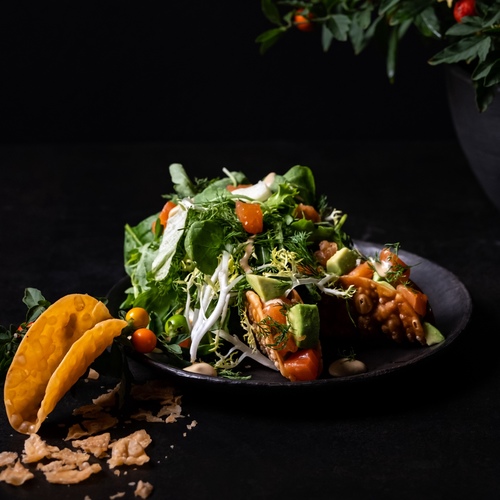 Salmon Taco salad - fresh salmon , baby spinach , baby rocca , frisee lettuce & dill served with taco and avocado , spicy mayo with soya dressing