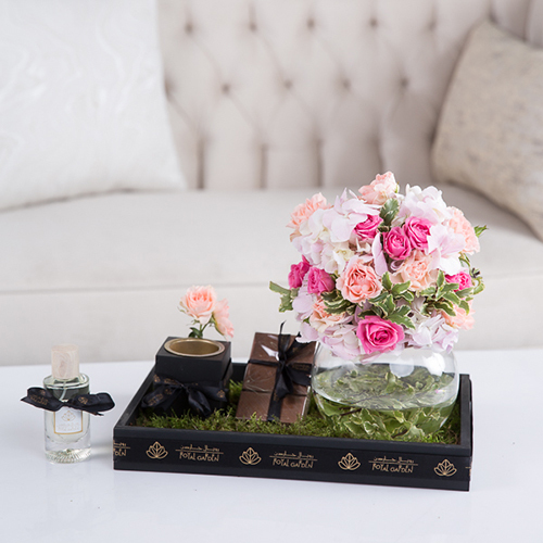 Samantha - Baby roses, wax flowers, hydrangea, green leaves, flot moss, Belgian chocolate, perfume and mubkhar.