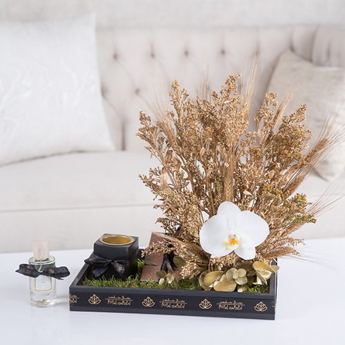 Kennedy - Cut flowers, gold solidago, triacum rice gold, flot moss, Belgian chocolate, perfume and mubkhar.