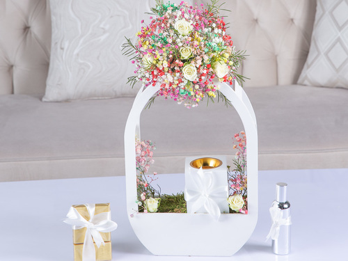 Royal Garden - Molly - The arrangement contains baby roses, gypsophila, perfume, mubkhar and Belgian chocolate.