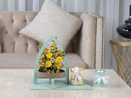 Soft - The arrangement contains a mix of flowers and leaves with mubkhar, and Belgian chocolates.
Height: 30 cm, Width: 34 cm