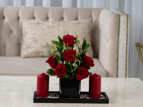 Prestige - The arrangement contains mix of flowers and leaves with candles and stones.
Height: 30 cm, Width: 34 cm