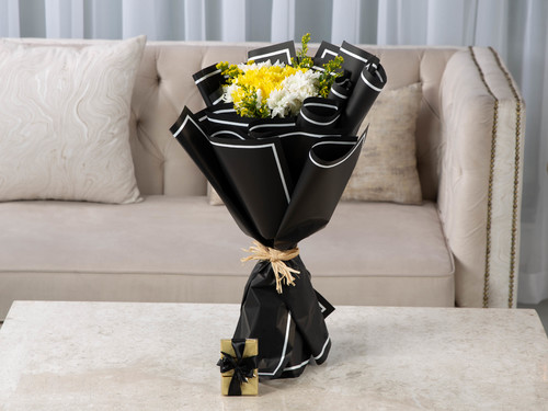 Passion - The arrangement contains crysanthemum and solidago in addition to the Belgian chocolate.
Height: 48 cm, Width: 30 cm