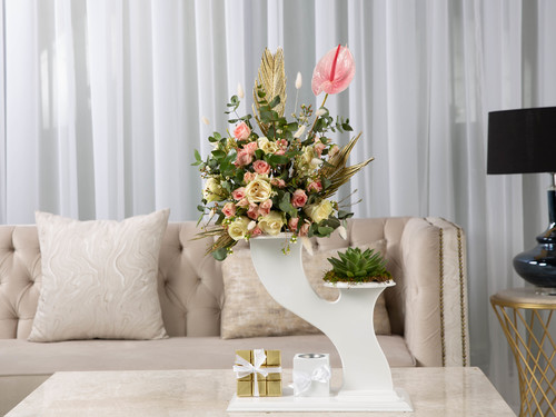 Monay - The arrangement contains Echeveria plant, a mix of flowers, anthurium, eucalyptus, and dried decorations in addition to Mubkhar and Belgian chocolates.
Height: 70 cm, Width: 20 cm