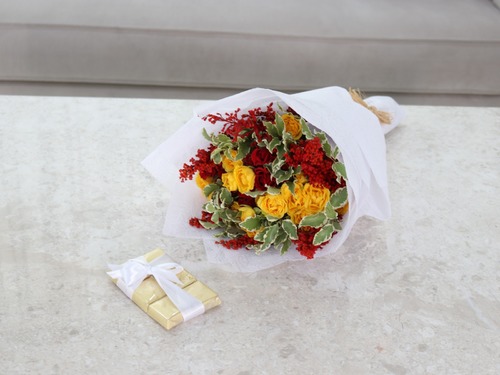 Adalyn - The arrangement contains a mix of flowers and Belgian Chocolates. Width: 30 cm, Height: 30 cm