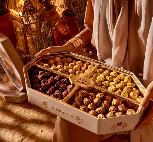 Assortment of stuffed petit fours with an Arabic flavor - New selection of stuffed petit fours, with four distinctive flavors: lemon, chocolate, cream, and caramel.