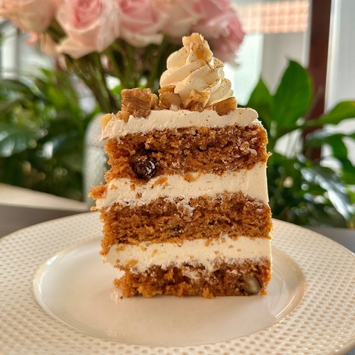 CARROT CAKE - Carrot cake sponge, cream cheese frosting & walnuts.