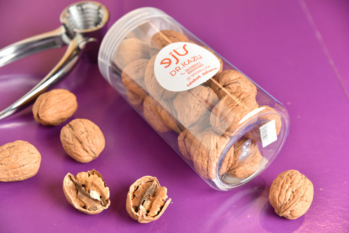 A box of walnuts with shells, 300 grams