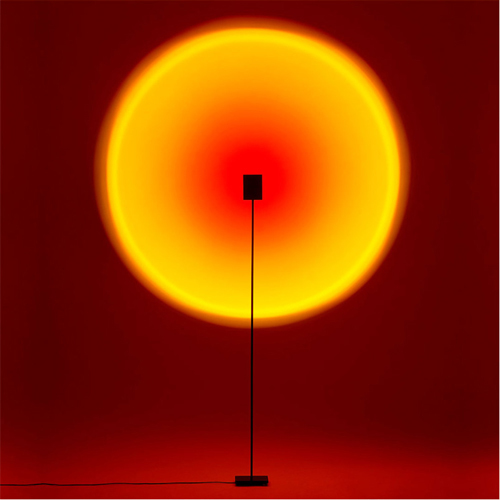 Sunrise rainbow lamp for photography and decoration 9806 - The Halo Edition One Floor Lamp is an innovative and sophisticated lamp that mixes technology with art. It incorporates a stylish optical system and a high-power LED to produce an exceptional lighting system. This floor lamp is particularly made to realize the perfect protection of shades and colors. The core of the project is the intangible element of the light, while the initiative is to create a minimal and compact object, using the best installation effect.  Halo Edition One Floor Lamp introduces the latest extraordinary different colors to each home, letting the viewer immerse himself. This ground-breaking floor lamp is created from anodized aluminum engraved from a rock-hard plate. The addition of the supple head increases the versatility of the floor lamp and allows diverse projection compositions, allowing new lighting setup and graphic composition. This floor lamp is the best fit for a living room, bedroom, or reading room.  Halo Edition One Floor Lamp beautifies your indoor space as it offers you munificent light when you desire and gives dimming when you do not want. It is a modern floor lamp perfect for localized lighting in the workspaces. The floor lamp is a great way to get direct lighting in any area you want. The stand of this lamp fits underneath most chairs, recliners, and couches, meaning that you can get light on the sectional without Halo Edition One Floor Lamp taking up additional room.