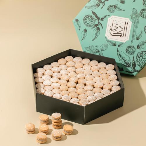 Hala Al Amira - Two layers of petit four with fillings caramel and coconut with sugar powder